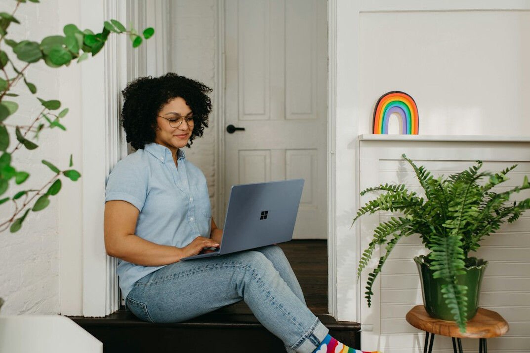 person reading on laptop