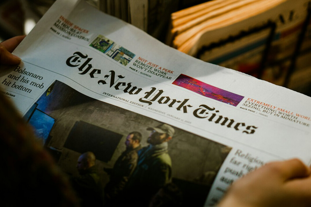 person reading newspaper
